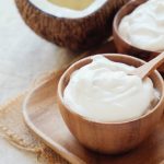 homemade organic coconut greek yogurt in wooden bowl